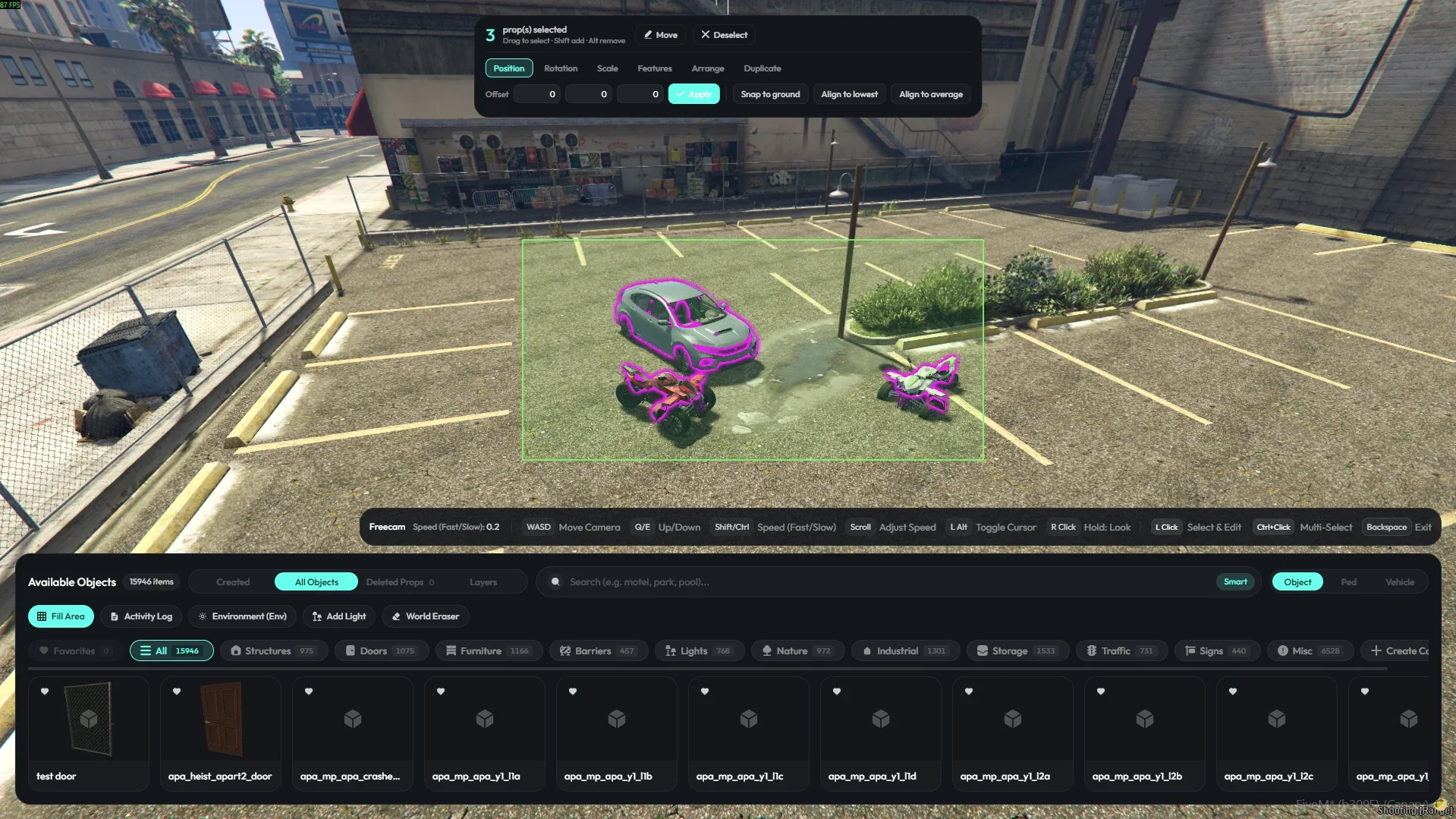 Three props captured by box selection, with a mass edit panel above offering position, rotation, scale and arrange tabs.